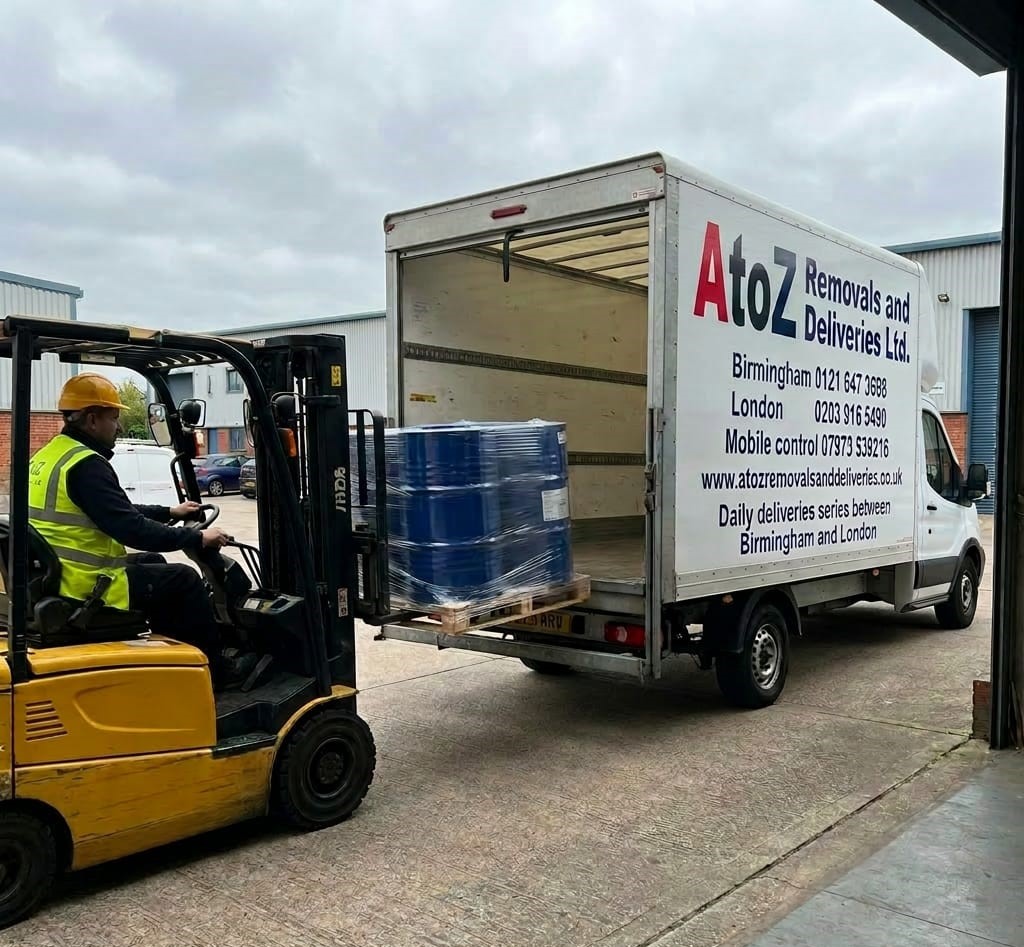 A to Z Removals forklift loading a pallet of drums into a branded Luton van — daily Birmingham & London deliveries